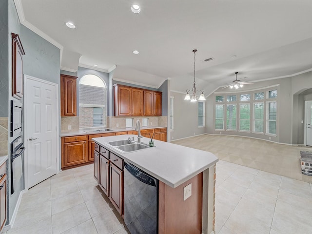 kitchen featuring visible vents, a ceiling fan, light countertops, a sink, and dishwasher