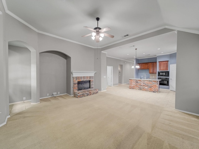 unfurnished living room featuring baseboards, a ceiling fan, and light colored carpet