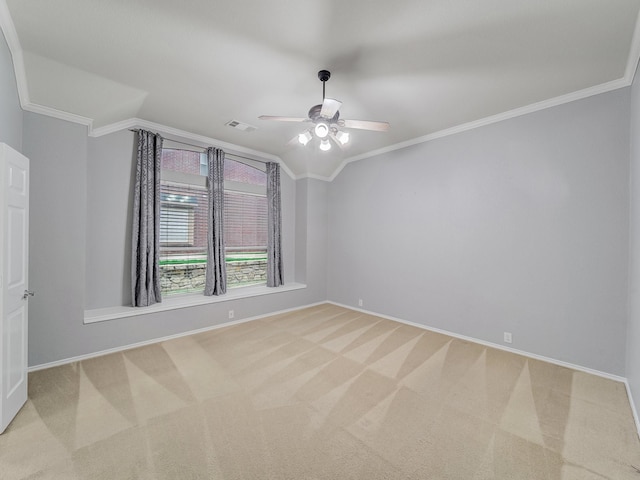 unfurnished room with crown molding, baseboards, and light carpet