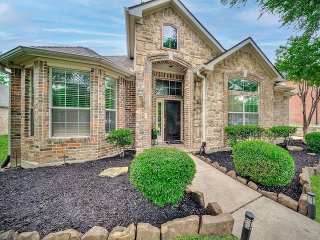 view of front of house with brick siding