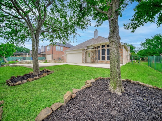 view of front of property with a garage, a front lawn, fence, a chimney, and driveway
