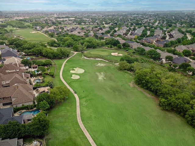 birds eye view of property featuring view of golf course and a residential view