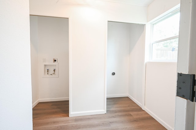laundry room featuring washer hookup, laundry area, electric dryer hookup, light wood-type flooring, and baseboards