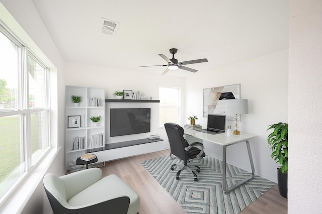 8511 Strathmore Dr, Dallas, TX 75238 - office featuring a ceiling fan and wood finished floors
