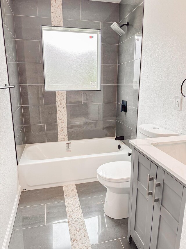 8511 Strathmore Dr, Dallas, TX 75238 - full bathroom featuring bathtub / shower combination, toilet, vanity, and a textured wall