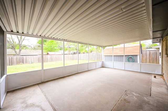 unfurnished sunroom with a wealth of natural light