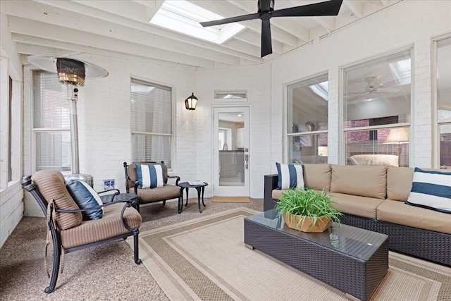4460 Connemara Dr, Frisco, TX 75034 - sunroom / solarium with outdoor lounge area, ceiling fan, beam ceiling, and a skylight