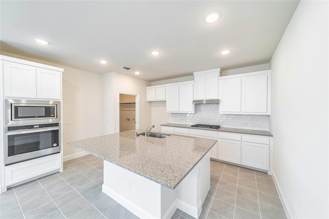 341 Gleneagles Dr, Garland, TX 75040 - kitchen featuring backsplash, visible vents, appliances with stainless steel finishes, a sink, and white cabinets