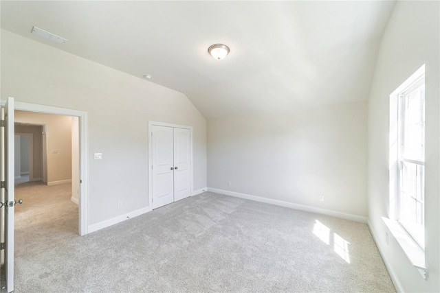 341 Gleneagles Dr, Garland, TX 75040 - additional living space featuring plenty of natural light, carpet, vaulted ceiling, and visible vents