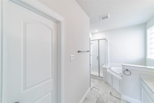341 Gleneagles Dr, Garland, TX 75040 - full bath with marble finish floor, baseboards, visible vents, a garden tub, and a stall shower