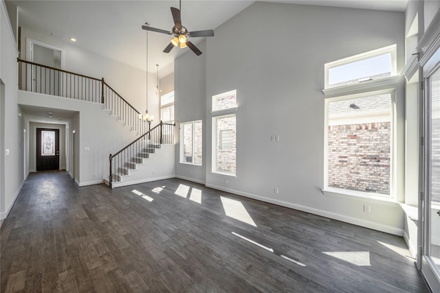 341 Gleneagles Dr, Garland, TX 75040 - unfurnished living room with stairs, a ceiling fan, high vaulted ceiling, and dark wood-style flooring