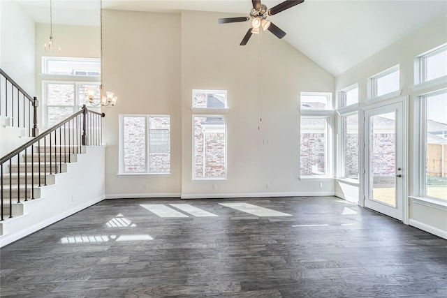 341 Gleneagles Dr, Garland, TX 75040 - unfurnished living room with dark wood-style flooring, high vaulted ceiling, and plenty of natural light