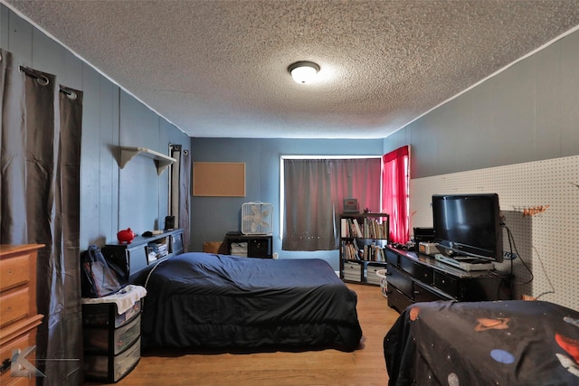 934 Burger St, Abilene, TX 79603 - bedroom with a textured ceiling and wood finished floors