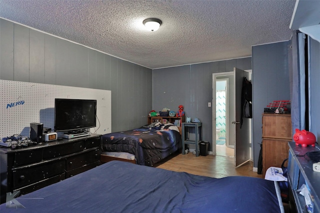 934 Burger St, Abilene, TX 79603 - bedroom featuring a textured ceiling and wood finished floors