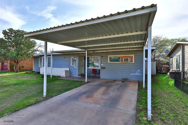 934 Burger St, Abilene, TX 79603 - view of front of house featuring a front lawn, fence, and a carport