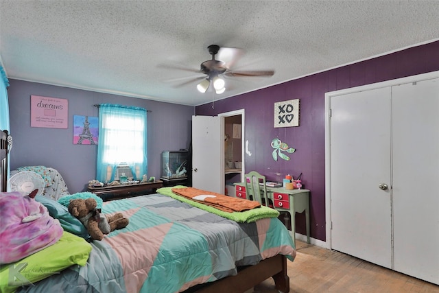 934 Burger St, Abilene, TX 79603 - bedroom with a ceiling fan, a textured ceiling, cooling unit, and light wood-style floors