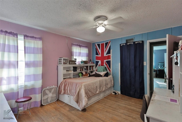 934 Burger St, Abilene, TX 79603 - bedroom featuring a ceiling fan, a textured ceiling, and wood finished floors