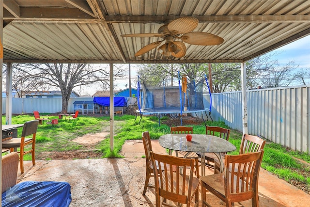 934 Burger St, Abilene, TX 79603 - view of patio / terrace featuring a fenced backyard, a ceiling fan, outdoor dining area, and a trampoline