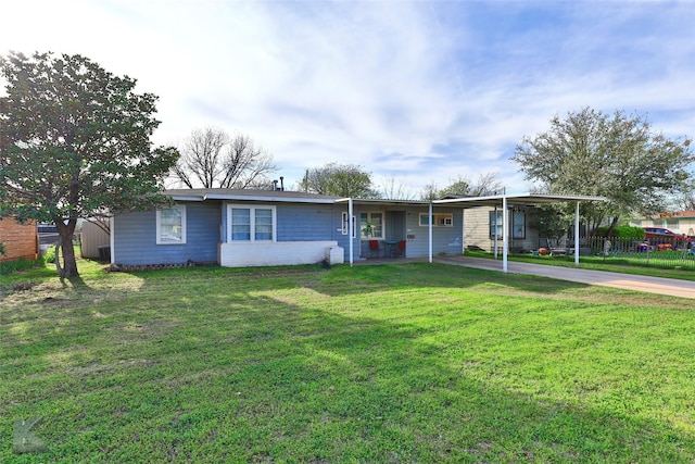 934 Burger St, Abilene, TX 79603 - ranch-style house featuring fence, an attached carport, driveway, and a front yard