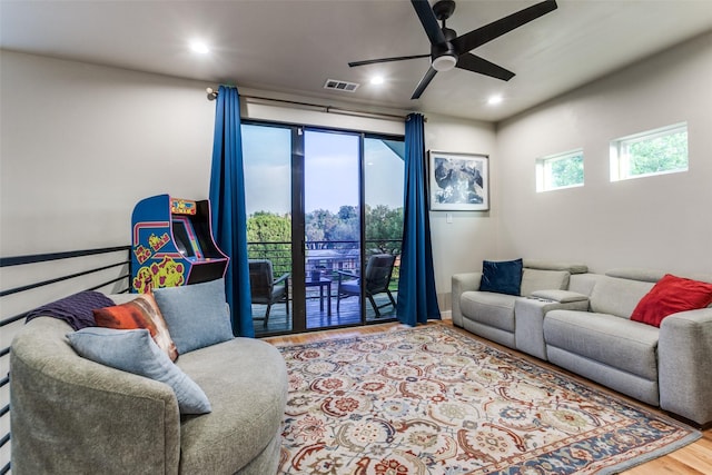 11955 Hoblitzelle Dr, Dallas, TX 75243 - living area with wood finished floors, ceiling fan, and recessed lighting