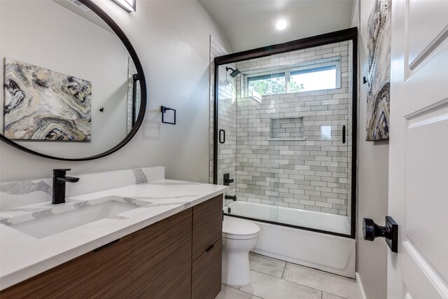 11955 Hoblitzelle Dr, Dallas, TX 75243 - full bathroom with toilet, bath / shower combo with glass door, tile patterned flooring, and vanity