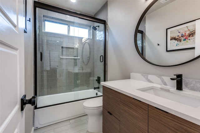 11955 Hoblitzelle Dr, Dallas, TX 75243 - full bath featuring toilet, vanity, and combined bath / shower with glass door