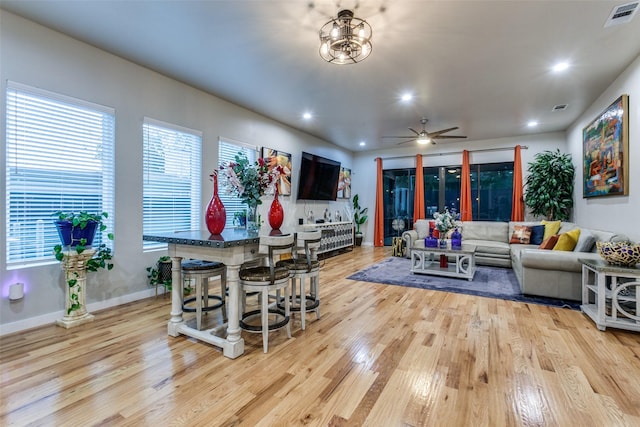 11955 Hoblitzelle Dr, Dallas, TX 75243 - living area featuring light wood-style floors, plenty of natural light, a ceiling fan, and recessed lighting