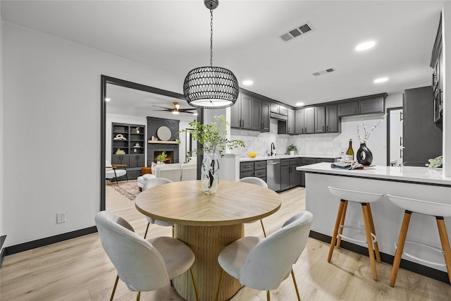 dining area featuring a ceiling fan, recessed lighting, and light wood-type flooring
