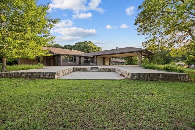 back of property featuring a gazebo, a yard, and a patio area