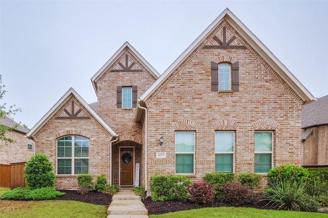 view of front of home featuring brick siding