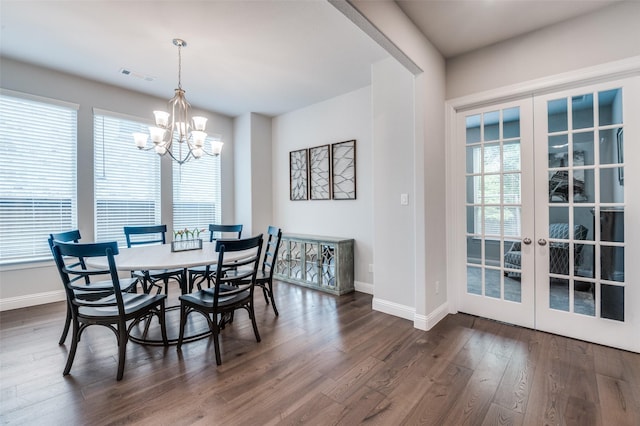 dining room featuring baseboards, dark wood-style floors, and visible vents