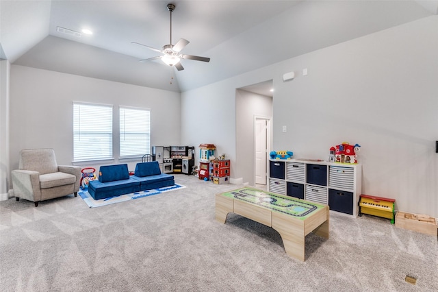 rec room featuring a ceiling fan, lofted ceiling, carpet, and visible vents