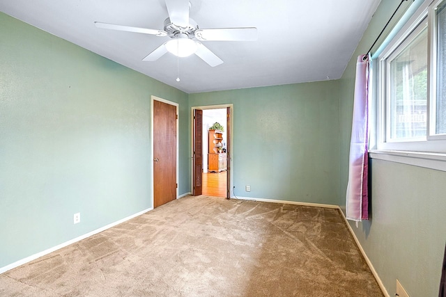 1730 W Hull St, Denison, TX 75020 - unfurnished bedroom featuring carpet floors, a ceiling fan, and baseboards