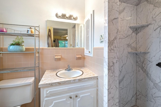 1730 W Hull St, Denison, TX 75020 - bathroom featuring tile walls, vanity, toilet, and a marble finish shower