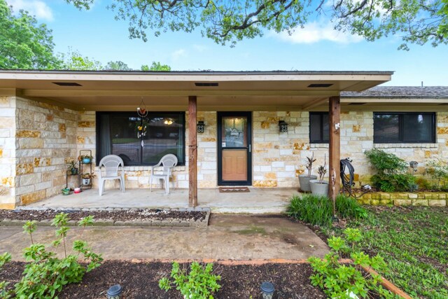 1730 W Hull St, Denison, TX 75020 - entrance to property with covered porch and stone siding