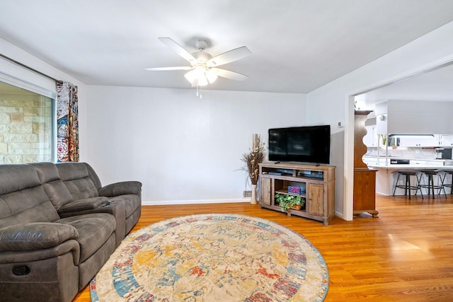 1730 W Hull St, Denison, TX 75020 - living area with baseboards, ceiling fan, and light wood finished floors