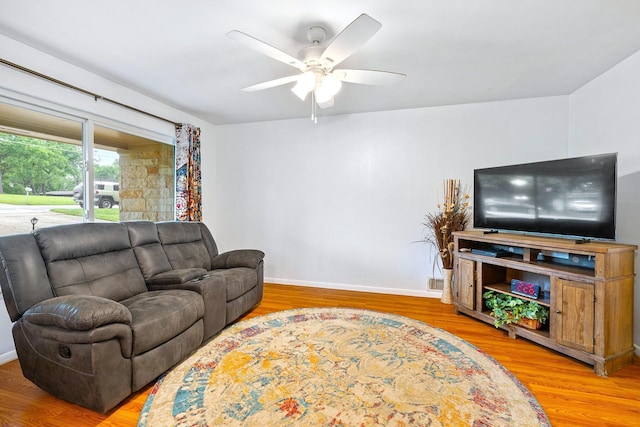1730 W Hull St, Denison, TX 75020 - living room with baseboards, a ceiling fan, and wood finished floors