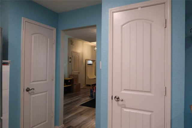 corridor featuring wood finished floors