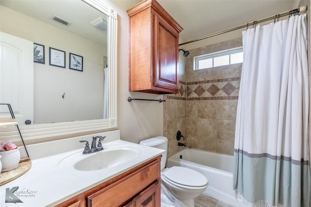 full bathroom with vanity, toilet, shower / bathtub combination with curtain, and visible vents