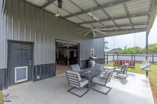 view of patio / terrace with a fenced backyard, outdoor dining space, and a ceiling fan