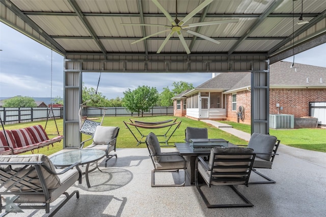 view of patio featuring a sunroom, central air condition unit, a gazebo, ceiling fan, and a fenced backyard