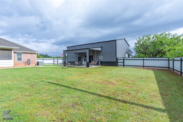 view of yard featuring a patio area, a fenced backyard, and central AC