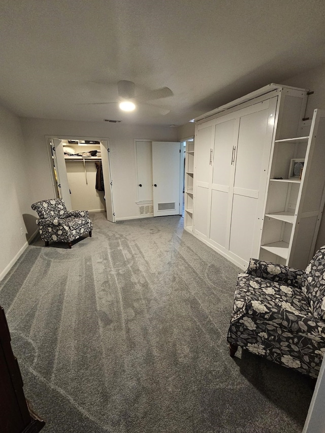 living area featuring baseboards and carpet flooring