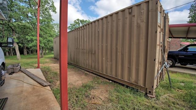 view of outbuilding featuring a carport