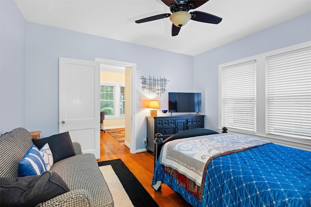 4204 Prescott Ave, Dallas, TX 75219 - bedroom with baseboards, ceiling fan, and wood finished floors