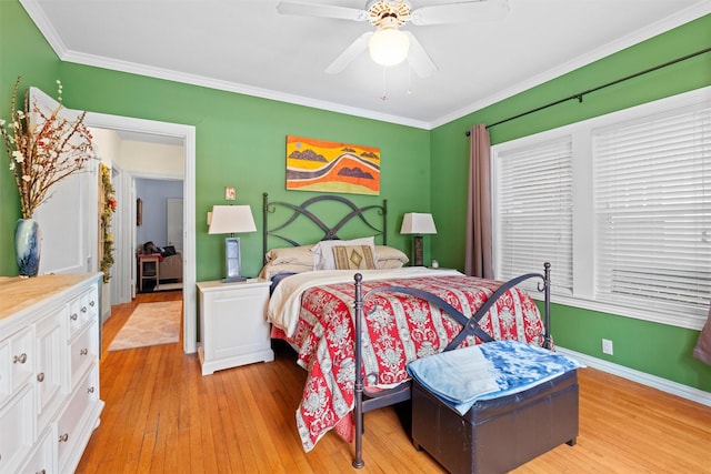 4204 Prescott Ave, Dallas, TX 75219 - bedroom with light wood-type flooring, ornamental molding, baseboards, and a ceiling fan
