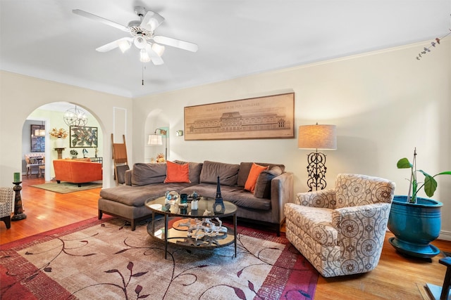 4204 Prescott Ave, Dallas, TX 75219 - living room featuring arched walkways, ornamental molding, a ceiling fan, and wood finished floors