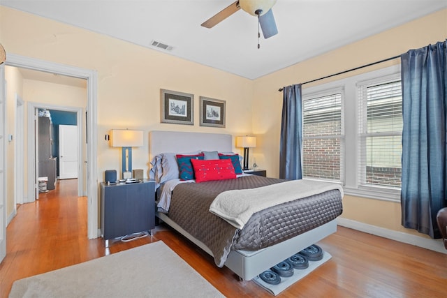 4204 Prescott Ave, Dallas, TX 75219 - bedroom with visible vents, baseboards, ceiling fan, and wood finished floors