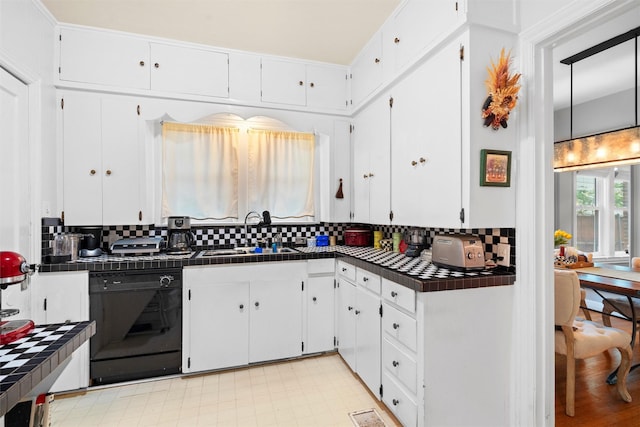 4204 Prescott Ave, Dallas, TX 75219 - kitchen with decorative backsplash, tile counters, white cabinets, a sink, and dishwasher