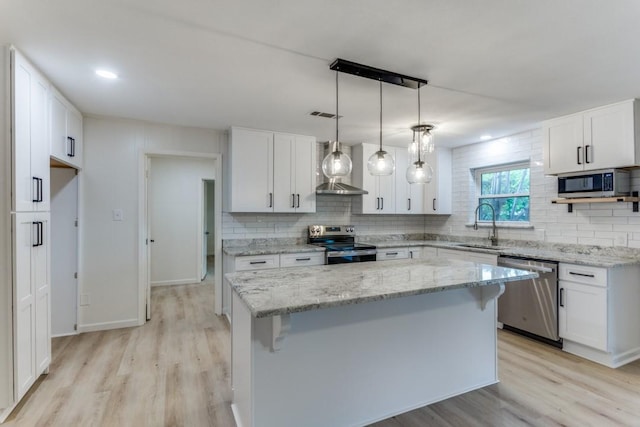 6148 Wrigley Way, Fort Worth, TX 76133 - kitchen with a sink, tasteful backsplash, stainless steel appliances, and light wood-type flooring